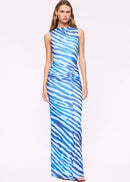 Woman wearing a blue and white patterned dress on a white background