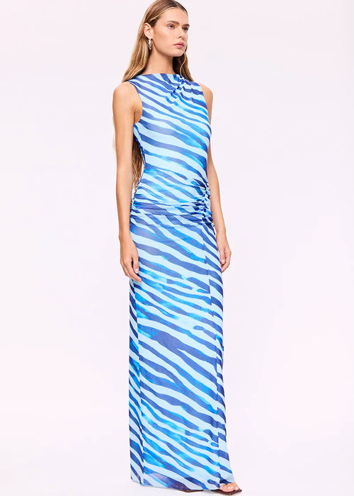 Woman wearing a blue and white striped dress on a white background