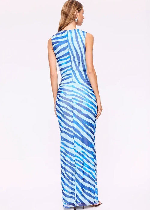 Woman wearing a blue and white striped dress on a white background