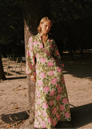 Woman in a floral dress standing in a park