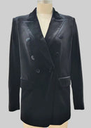 Black double-breasted coat on a mannequin against a grey background