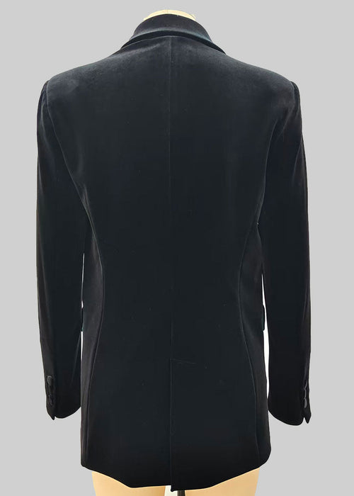 Black double-breasted coat on a mannequin against a grey background