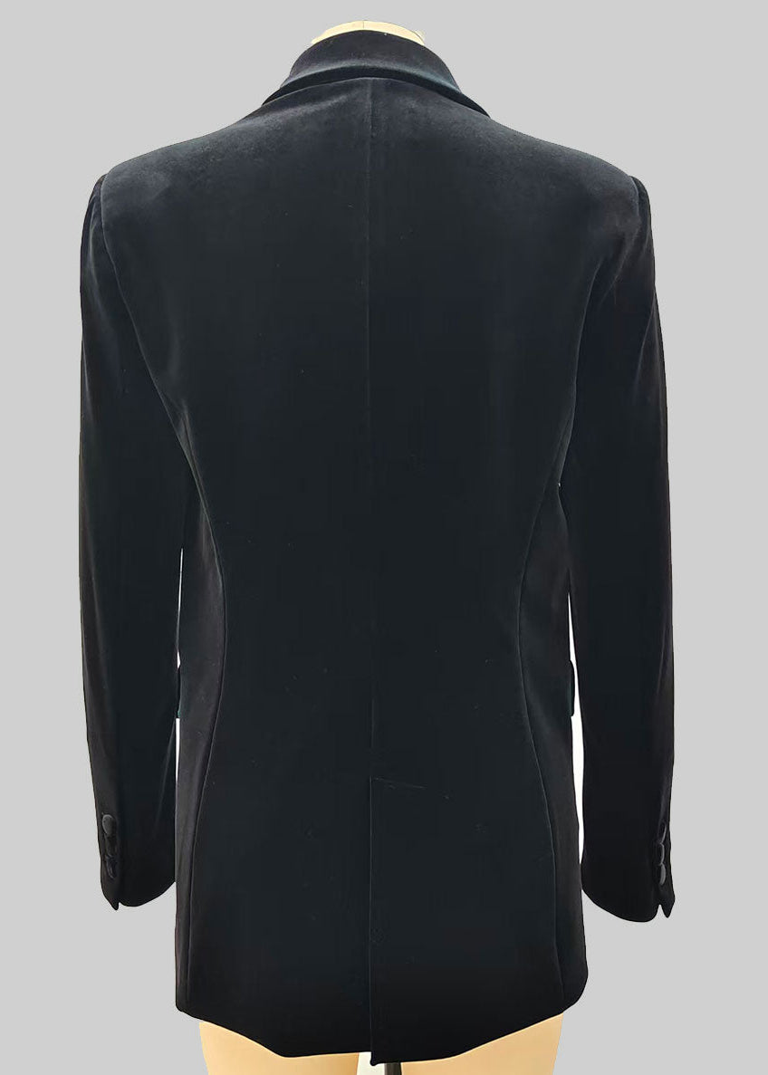 Black double-breasted coat on a mannequin against a grey background