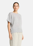 Woman wearing a grey sweater  on a white background