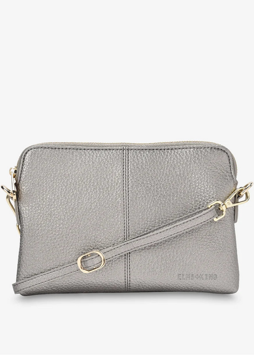A light grey pebbled leather crossbody bag with gold-tone hardware and a matching shoulder strap, shown against a plain white background.