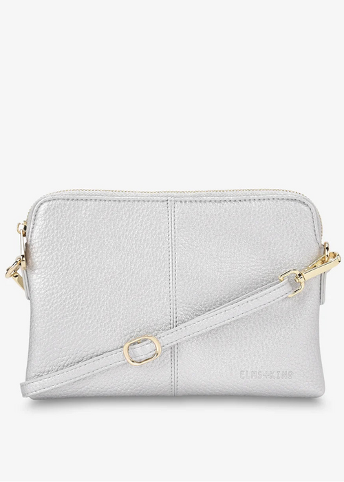 A light silver-grey pebbled leather crossbody bag with gold-tone hardware and a matching shoulder strap, shown against a plain white background.