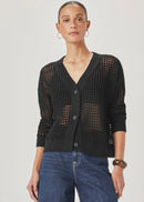 A model wearing a black open-knit cardigan with buttons and blue jeans, standing against a light grey studio background.