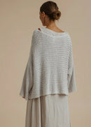 Woman weary silver knitted top on beige background