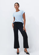 Woman wearing black jeans on white background