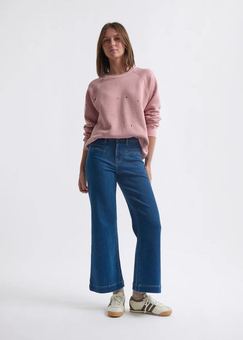 Woman wearing blue jeans on a white background