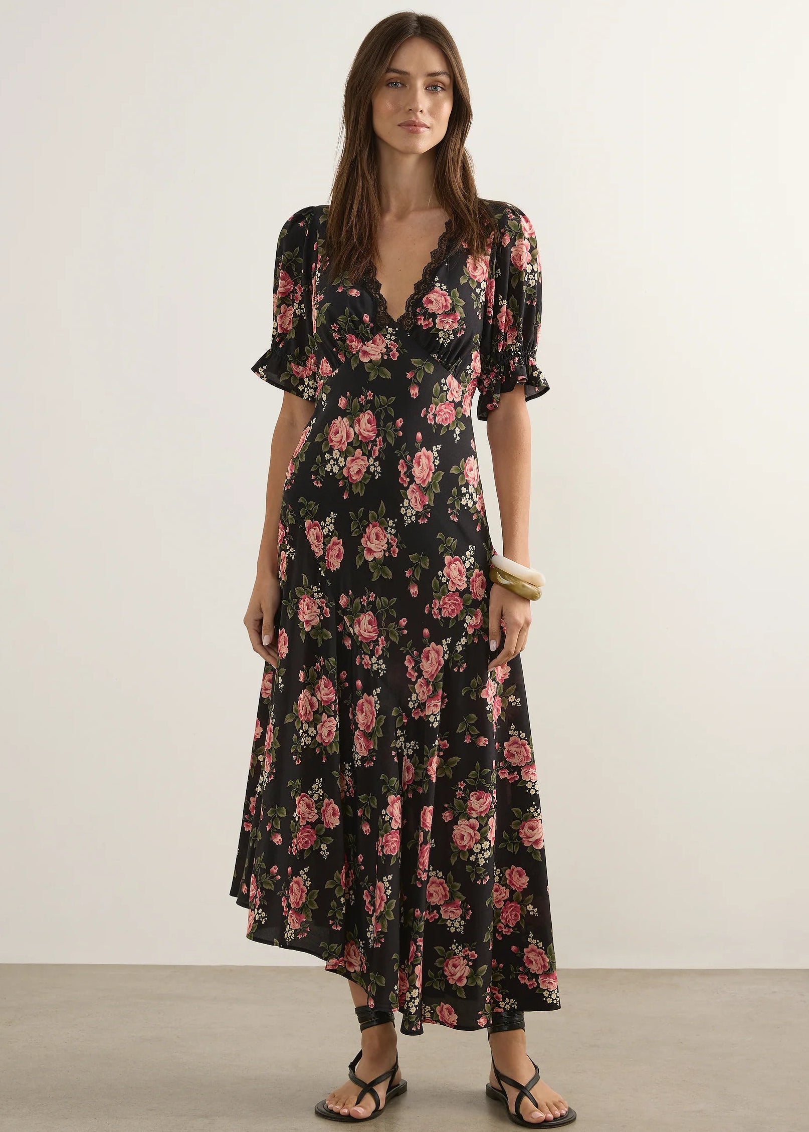 Woman wearing  floral dress on a wite background