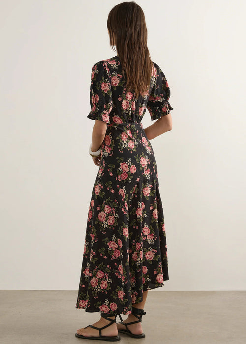 Woman wearing  floral dress on a wite background