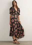 Woman wearing  floral dress on a wite background