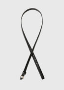Black leather belt on a light gray background