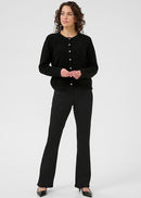 Woman wearing black cardigan on a white background