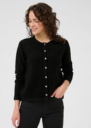 Woman wearing black cardigan on a white background