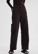 Brown pants worn by a person on a white background