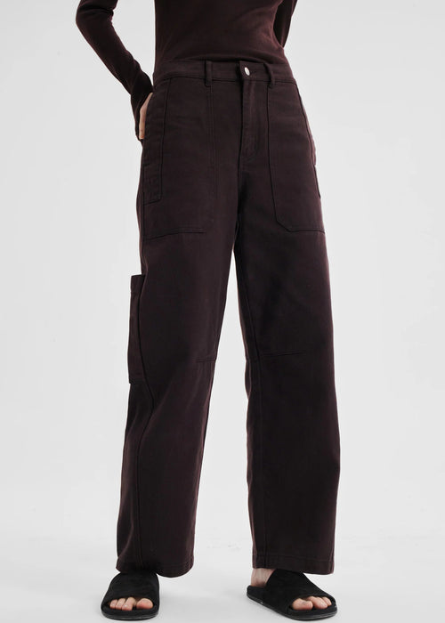 Brown pants worn by a person on a white background