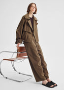 Woman wearing a brown pant on a white background