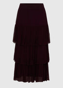 Dark purple tiered skirt on a light gray background