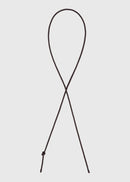 Brown leather belt on a light grey background