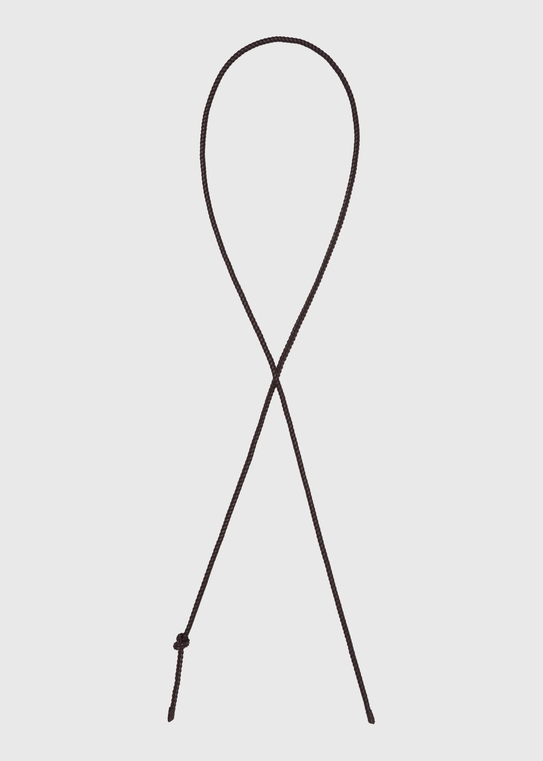 Brown leather belt on a light grey background
