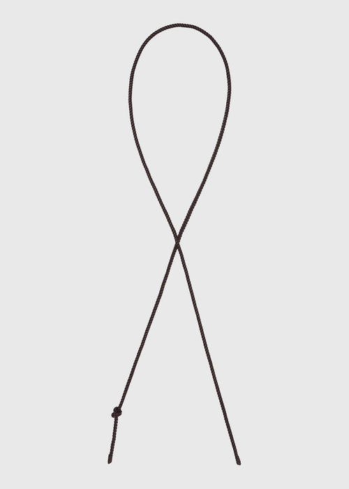 Brown leather belt on a light grey background