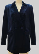 A dark navy blue velvet double-breasted blazer jacket displayed on a beige mannequin torso against a solid grey background.