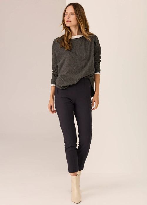 Woman wearing long sleeve tee with white background
