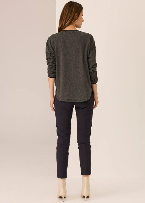 Woman wearing long sleeve tee with white background