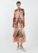 Woman wearing a floral dress on a white background
