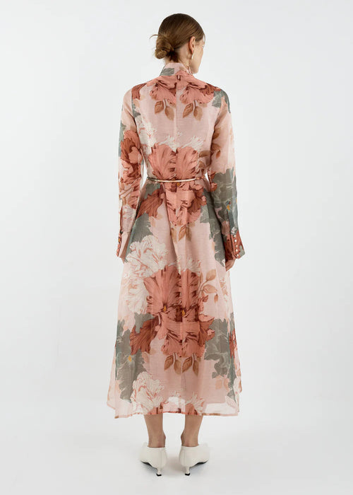 Woman wearing a floral dress with a white background