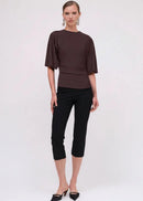 The Ivy Cape Sleeve Top is Suboo's refined take on a timeless essential. Crafted from soft stretch nylon, it delivers a sculpted silhouette that moves with you while maintaining its shape. The signature cape sleeves add contemporary edge, while strategic waist ruching flatters your frame. A clean neckline transitions effortlessly from casual to dressed-up moments, making this the versatile piece every wardrobe needs. Comfortable, elegant, and endlessly wearable.