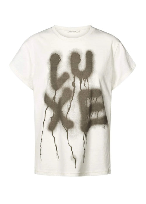 White t-shirt with 'LUXE' graphic design on a white background