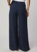Navy blue wide-leg pants worn by a person on a plain background