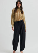Woman wearing black pants on a white background