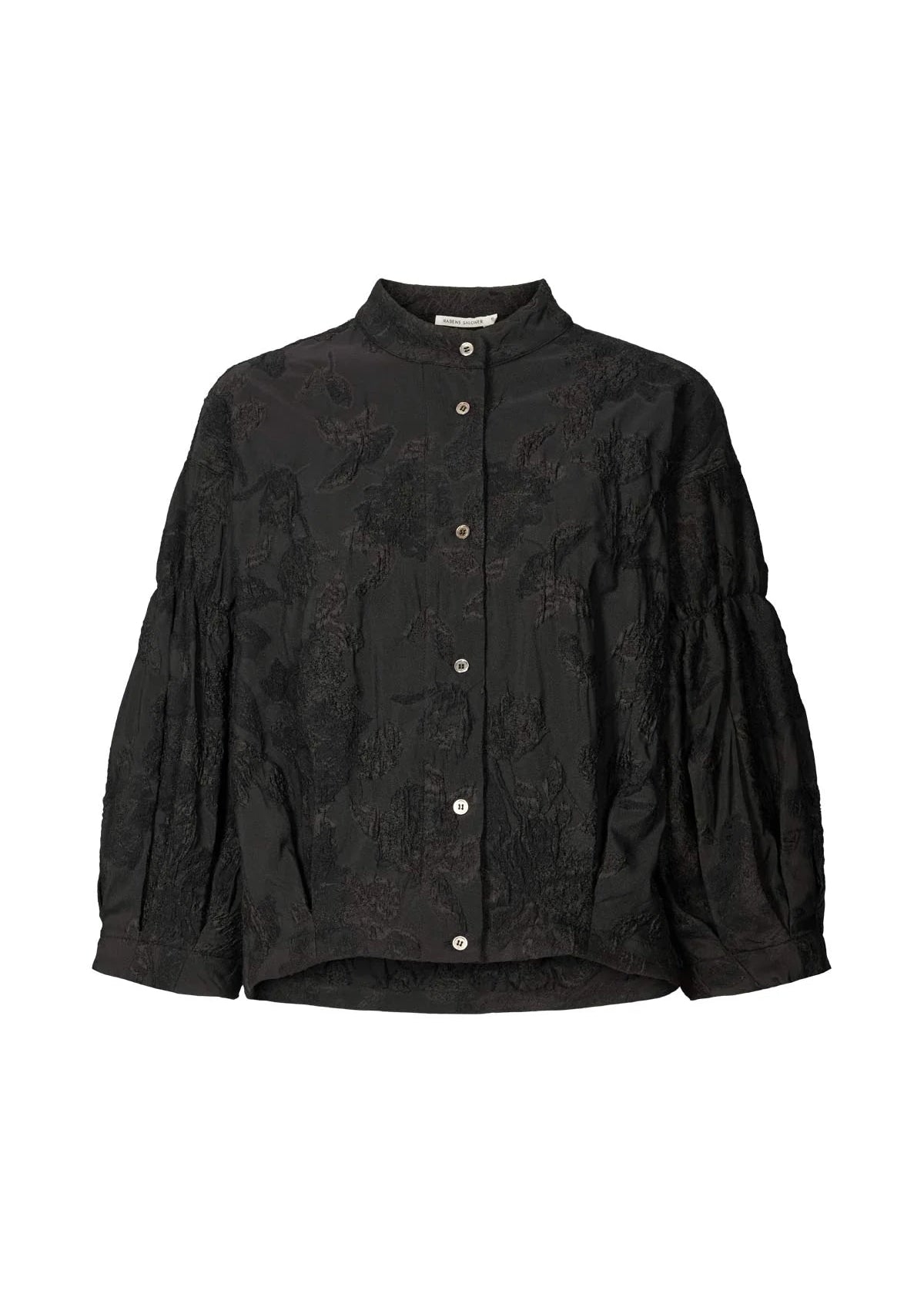 Black textured blouse with button details on a white background