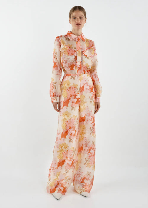 Person wearing a floral long-sleeve top