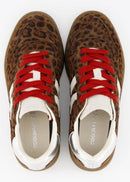 Pair of leopard print sneakers with red laces on a white background