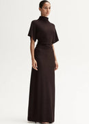Woman wearing a brown dress with a white background