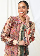 Woman wearing multi coloured top on white background