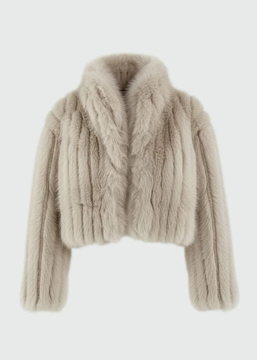 Beige faux fur jacket on a light grey background
