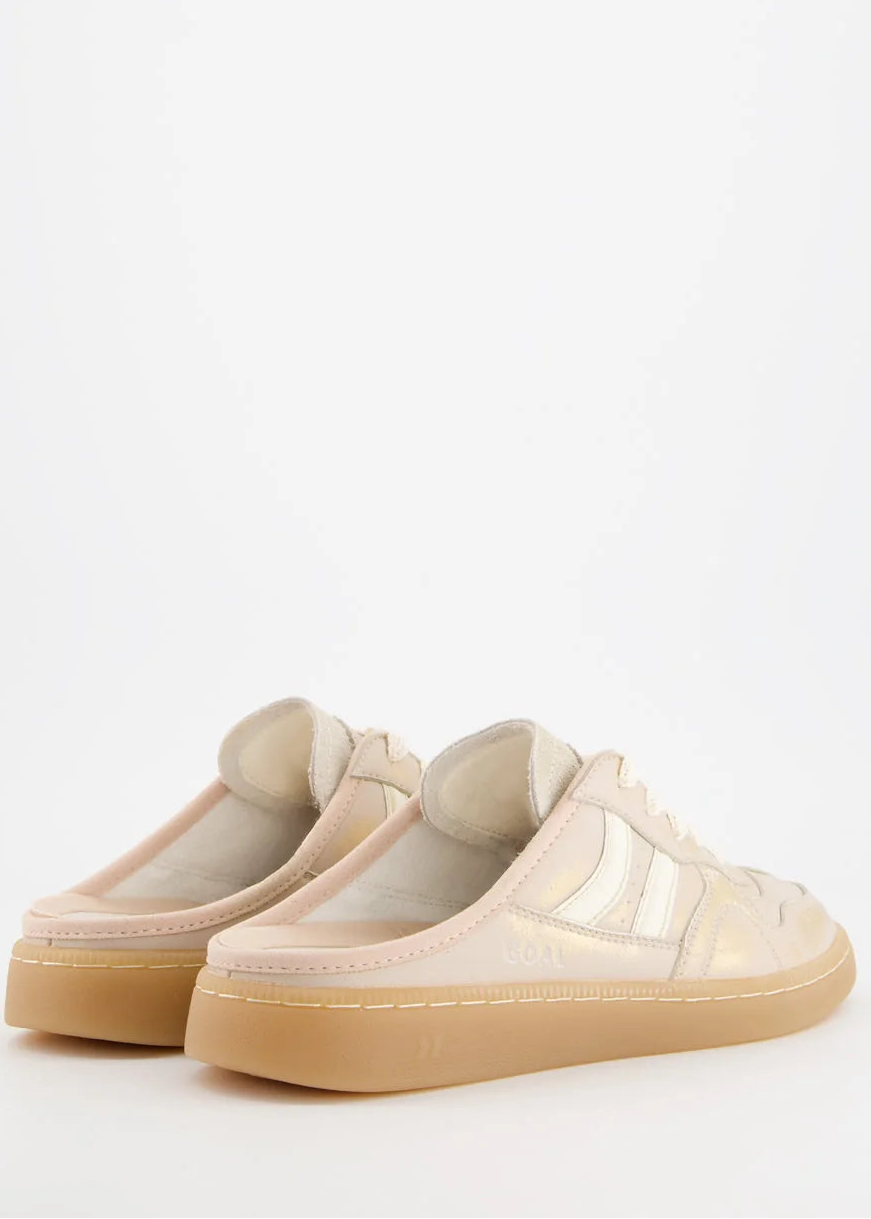 A low-top sneaker in a light beige and cream colorway with a gum sole, shown from the side against a plain white background.