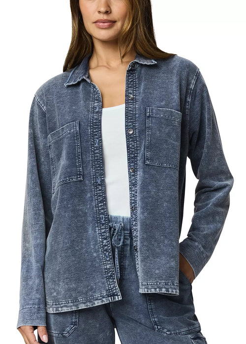 Woman wearing a blue denim shirt on a white background