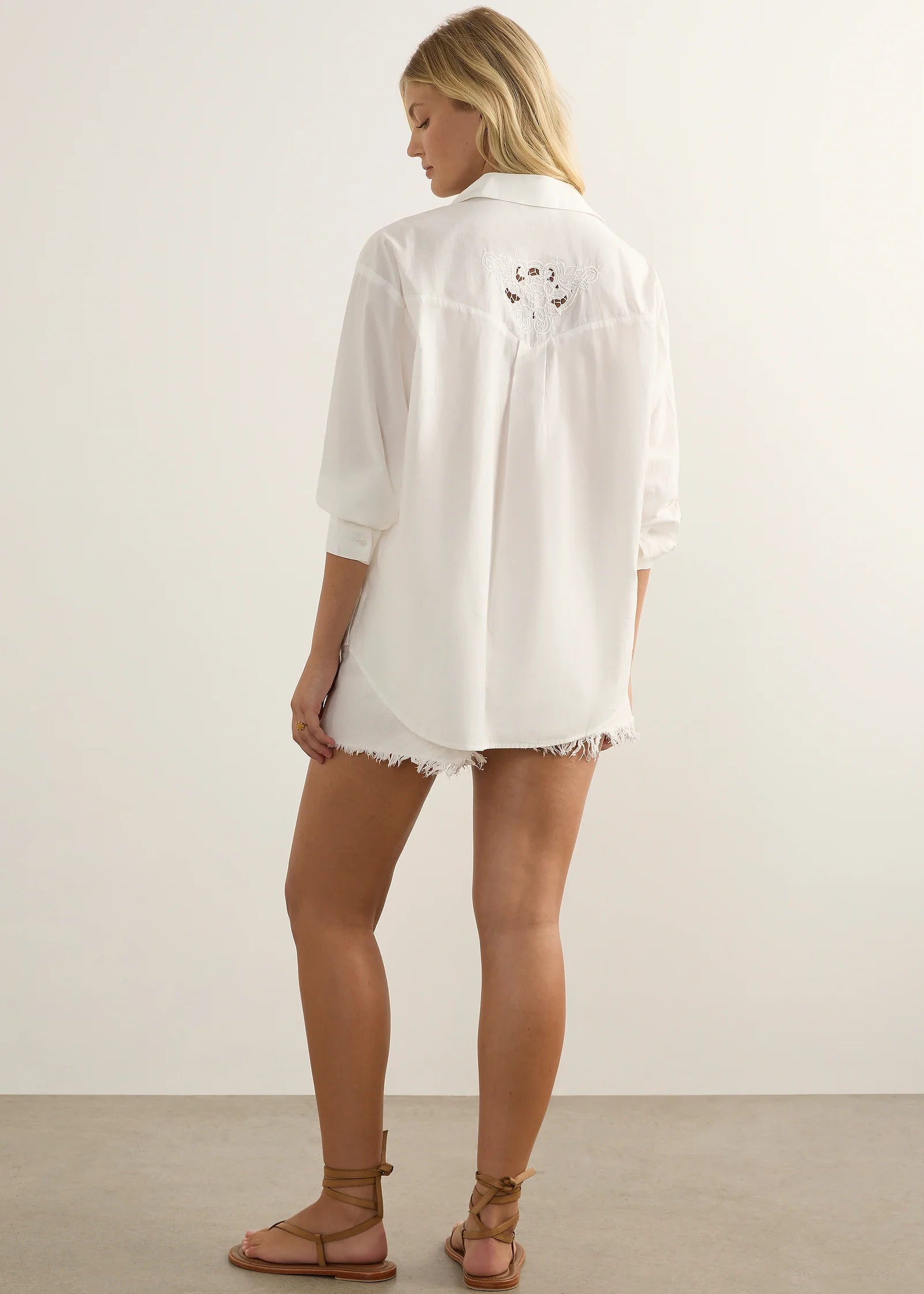 Woman wearing white shirt on white background