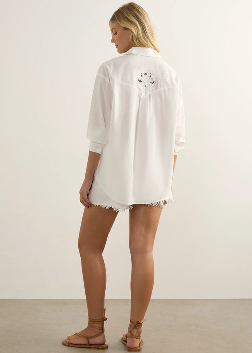 Woman wearing white shirt on white background
