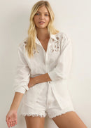 Woman wearing white shirt on white background