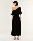Woman wearing a black one-shoulder dress on a white background