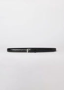 Black belt with silver buckle on a light grey background