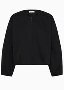 A black cropped zip-up jacket with long sleeves and a round neckline, shown flat against a plain white background.